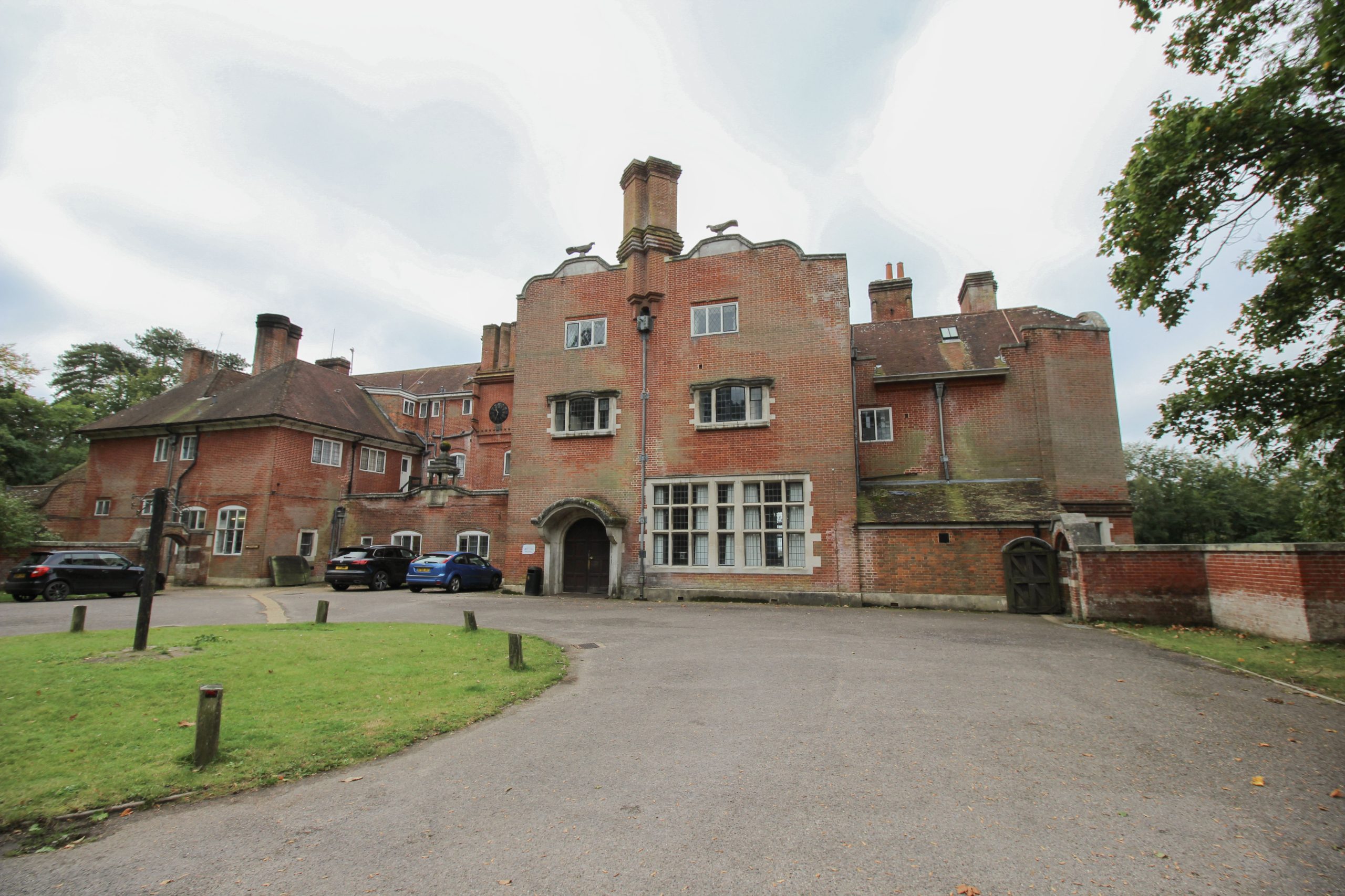 Avon Tyrrell manor house which is a calendar house and grade 1 listed heritage building - stone building in the forest with blue skies