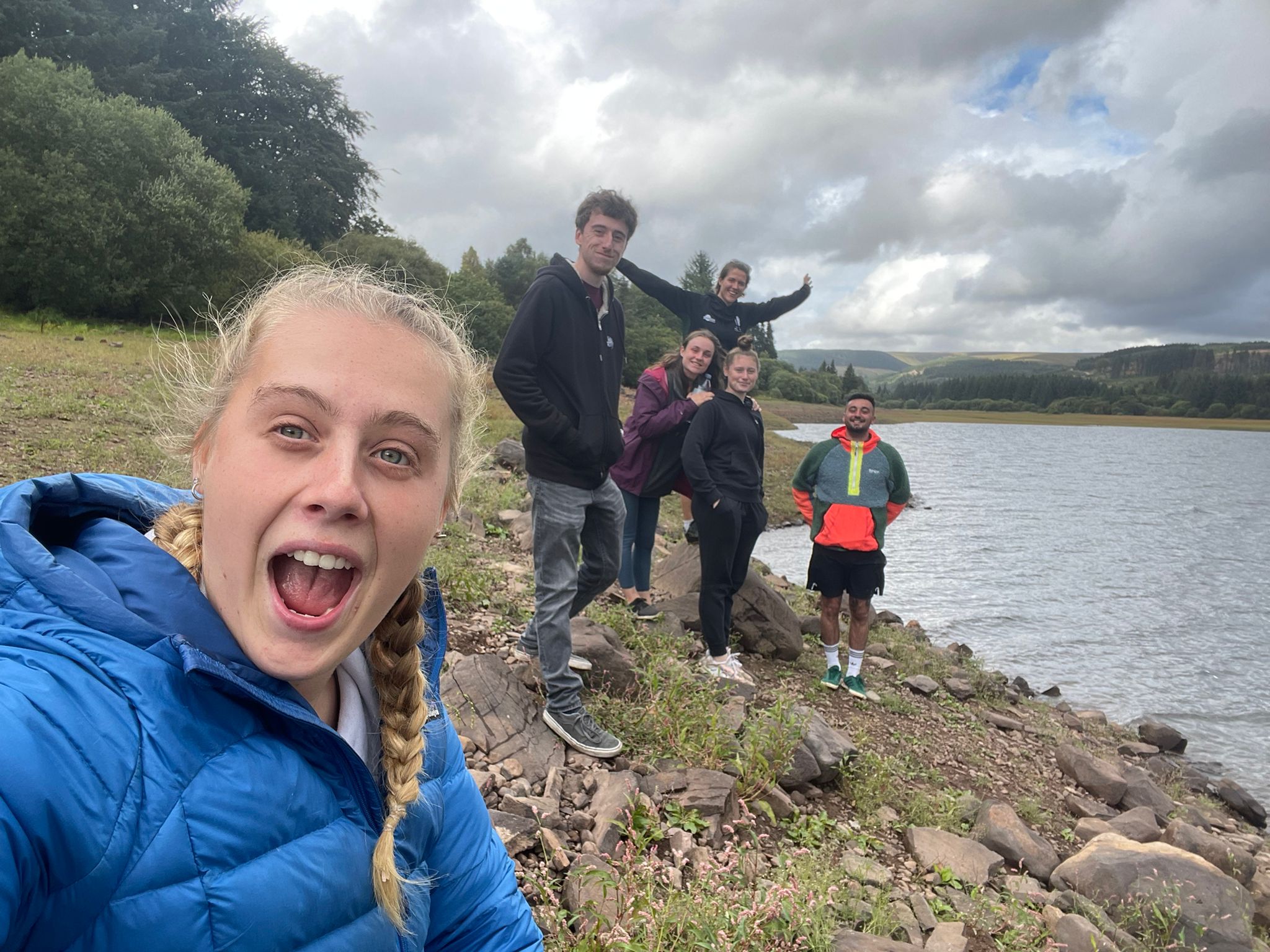 outdoor learning apprentices going on an outdoor walk with forest and lake views